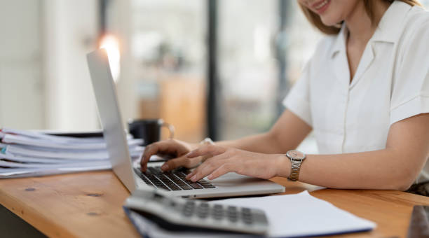 istock Successful Young Businesswoman Sitting at Her Desk Working on Laptop Computer 1435546807