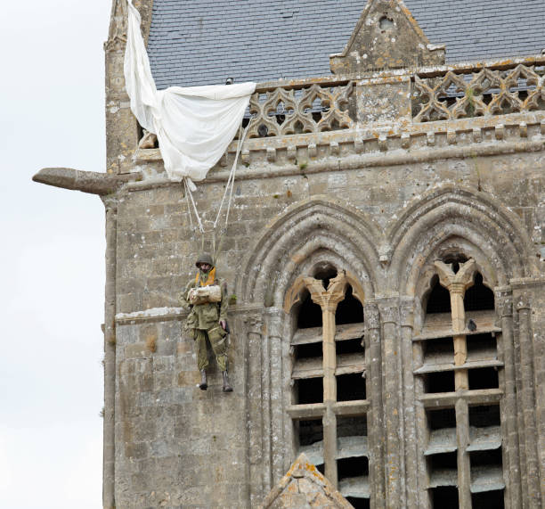 Sainte-Mere-Eglise, FRA, France - August 21, 2022: DDAY Memorial with Paratrooper on the bell tower