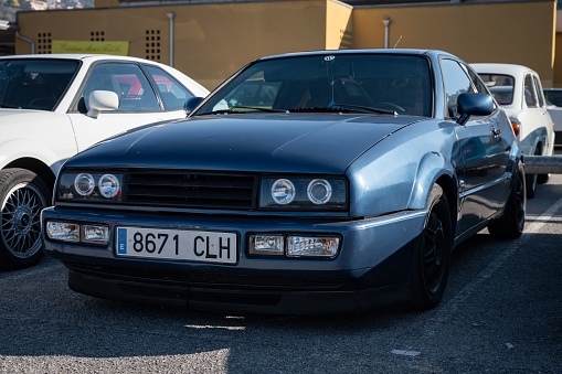 Barcelona, Spain – August 13, 2022: A detail of an old Volkswagen Corrado with round-tuned front lights.