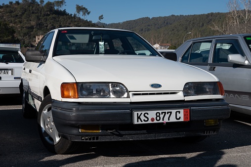 Barcelona, Spain – August 13, 2022: A detail of an old white Ford Scorpio car.