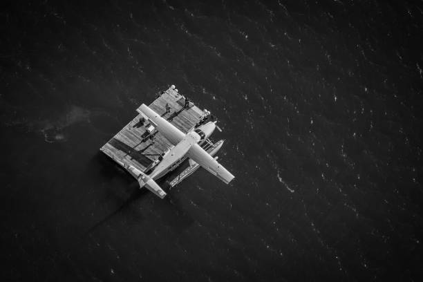 EVERETT, United States – August 24, 2022: A greyscale shot of a seaplane over the dock