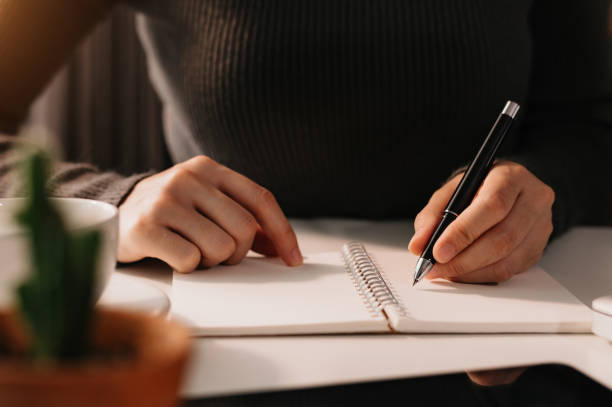istock businessman hand working with new modern computer and writing on the notepad strategy diagram 1435558290
