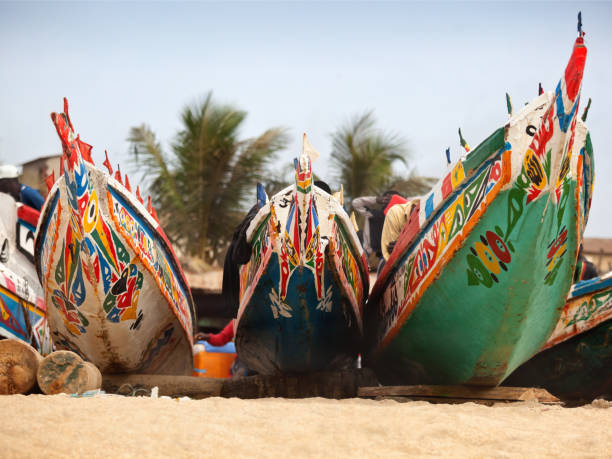 Cтоковое фото Декоративная расписная рыбацкая лодка Pirogues в Танджи в Гамбии Африка