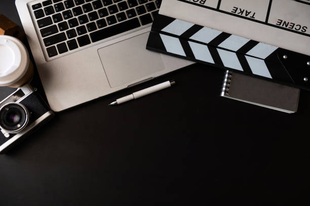 istock office stuff with Movie clapper, laptop, coffee cup, 1435558345