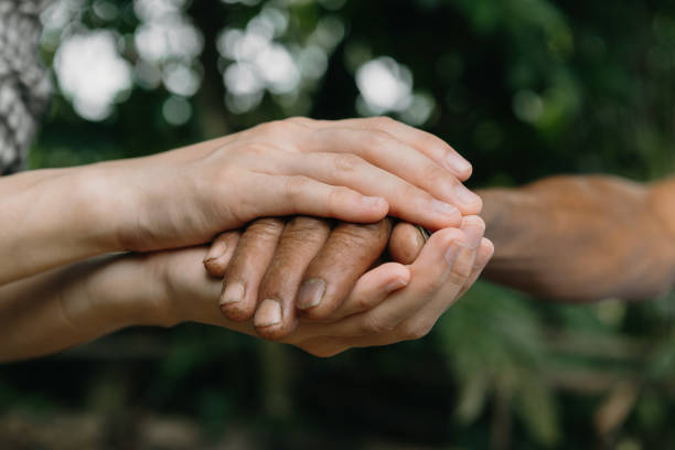 istock Hands of the old man and a man hand 1435558371