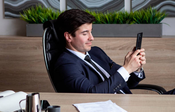 istock businessman in a dark blue suit working in the office 1435561873