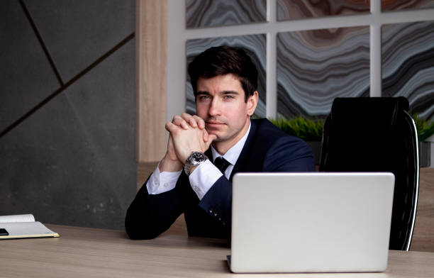 istock businessman in a dark blue suit working in the office 1435564142