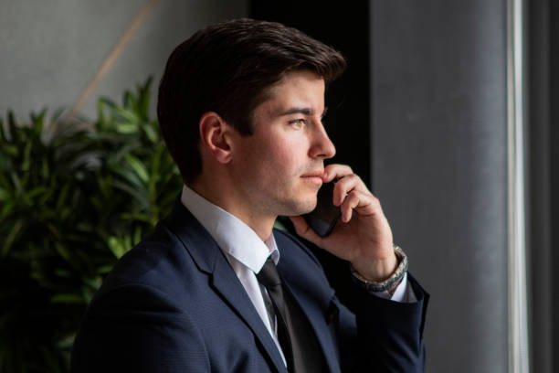 istock businessman in a dark blue suit working in the office 1435564857