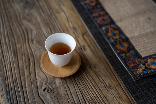 Tea cup with wood grain table top