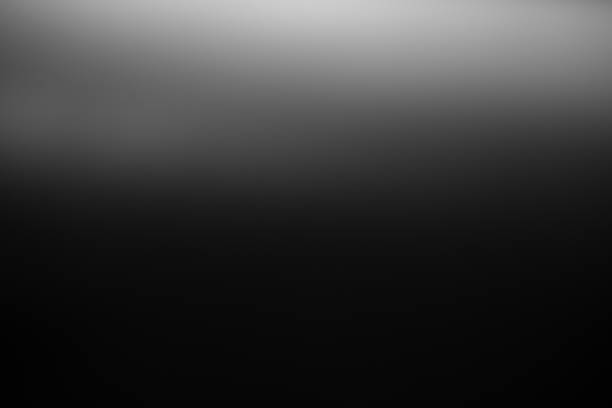 istock Dark black and gray blurred  gradient background has a little abstract light. 1435571399