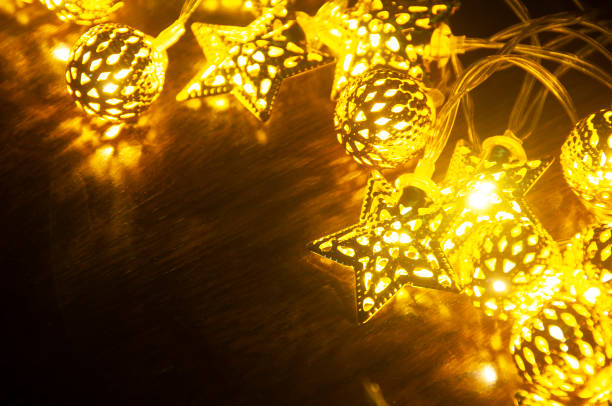 istock Shining Christmas golden balls and stars with customizable space for text. Copy space. 1435578640
