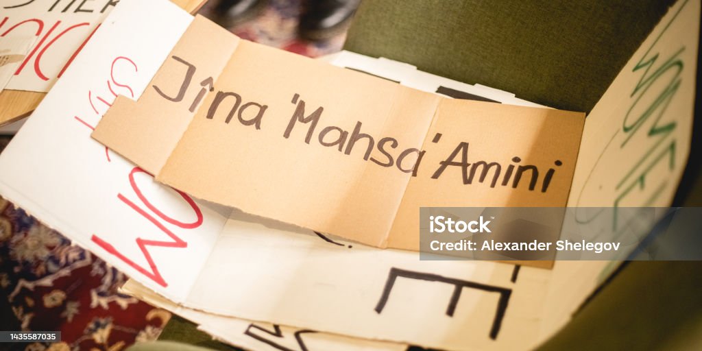 Paper banner for protest. Peace demonstration of people for support human rights and feminism. Female rights and girl power concept, preparations for marching. Text message Jina Mahsa Amini Mahsa Amini Stock Photo