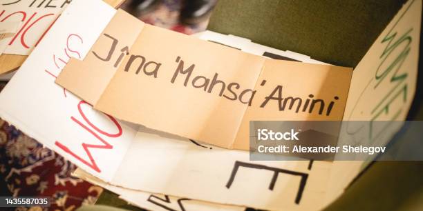 Paper Banner For Protest Peace Demonstration Of People For Support Human Rights And Feminism Female Rights And Girl Power Concept Preparations For Marching Text Message Jina Mahsa Amini Stock Photo - Download Image Now