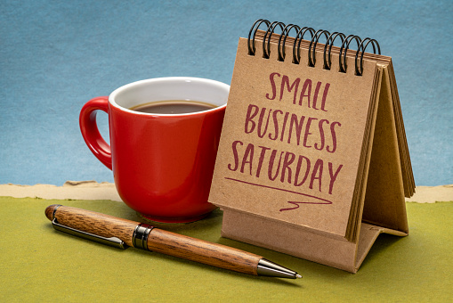 Small Business Saturday note - handwriting in a small desktop calendar, holiday shopping concept