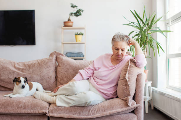 istock middle aged lady looking away sit alone at home feel anxious lonely, sad 1435593190