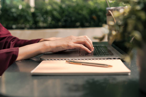 Business woman working on laptop computer. Outdoor work