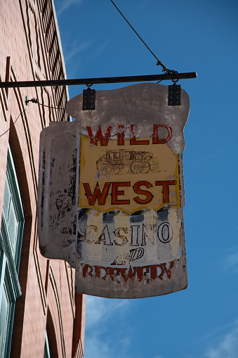 Antique worn out and abandoned building and sign in small wild west town Colorado on western USA, North America.
