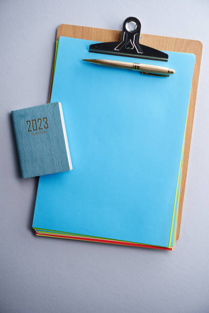 istock blank clipboard and 2023 diary against white background 1435596683