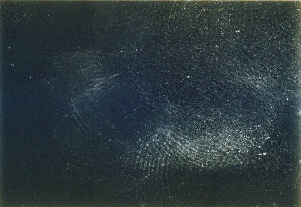 Dark filmstrip texture background with heavy grain and dust