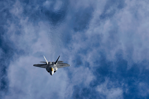 Miramar, California, USA - September 24, 2022: A Lockheed Marting F-22 Raptor completes a high altitude loop at the 2022 Miramar Airshow.