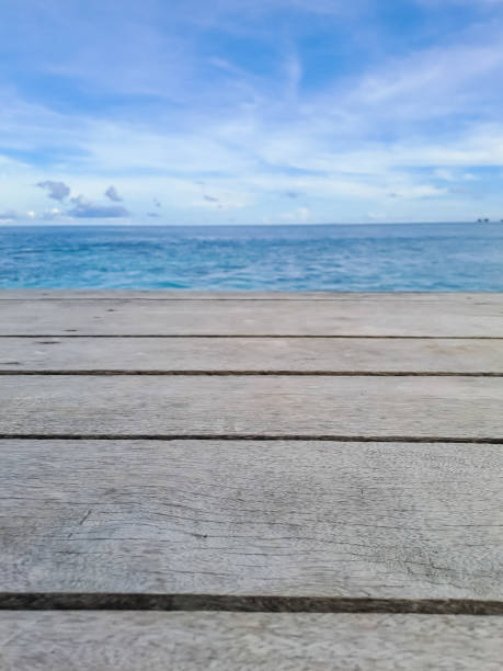 istock Wooden walkway on the beach. Jetty into the Blue. 1435601300
