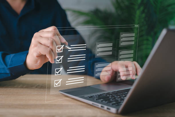 istock Electronic smart checklist and document on virtual screens concept, business people check electronic documents on digital documents, paperless offices,working on borderless communication technology 1435601439