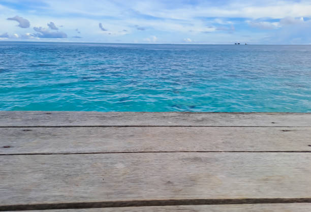 istock Wooden walkway on the beach. Jetty into the Blue. 1435602680