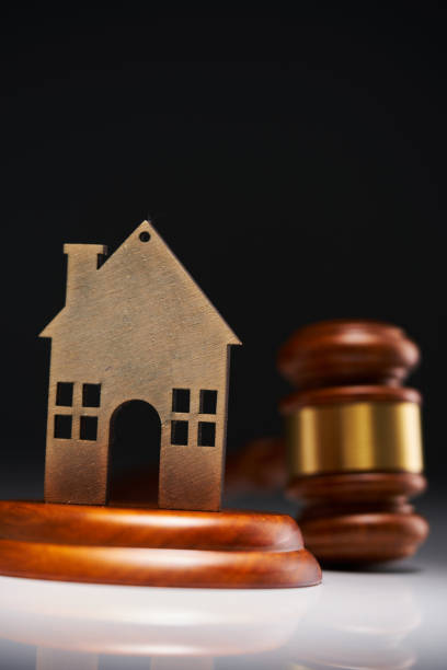 istock Gavel and model house  on the table. 1435602781