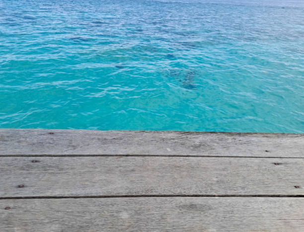 istock Wooden walkway on the beach. Jetty into the Blue. 1435602853