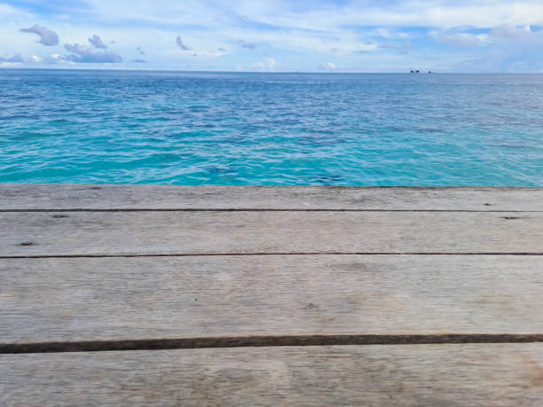 istock Wooden walkway on the beach. Jetty into the Blue. 1435604034