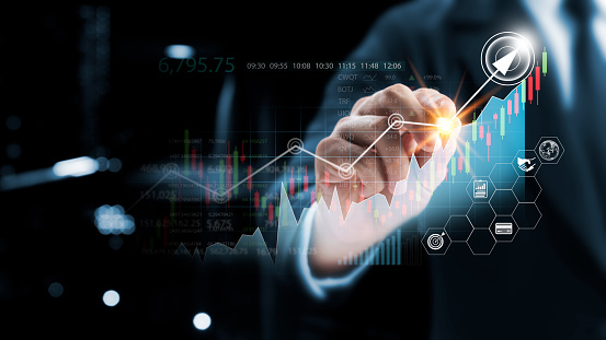 Businessman touching virtual screen and data statistical index graph, stock market data and stock exchange concept, stock market financial analysis graph.