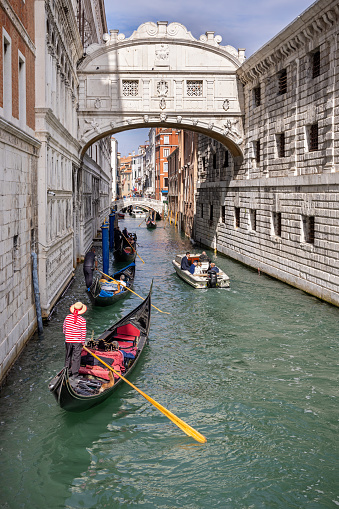 Gondolas on narrow canal in Venice, Italy