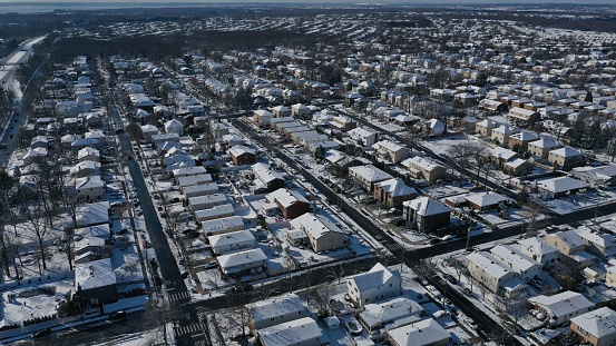 An aerial shot of houses covered with snow in Staten Island New York