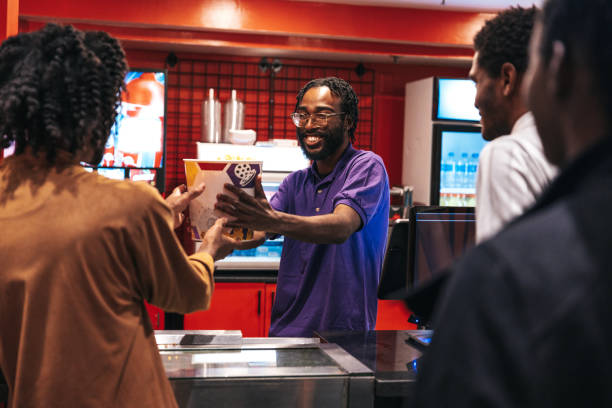 istock Friends buying popcorn at cinema 1435610298