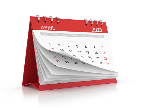 2023 April monthly calendar standing on a reflective background. Isolated on white background. Clipping path.