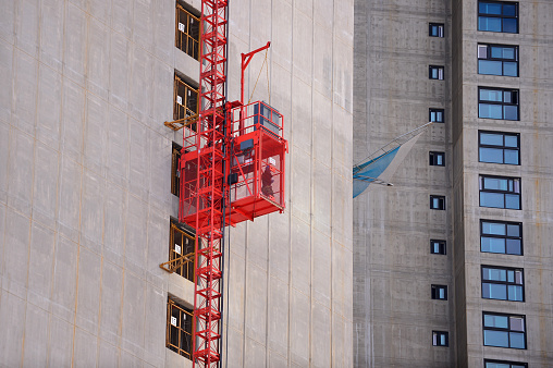 Elevator lift on apartment construction site.