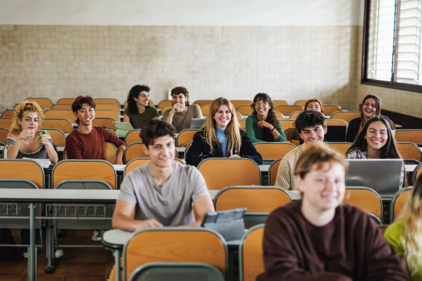 istock Young students smiling inside school classroom at university - Focus on blond girl face 1435611966