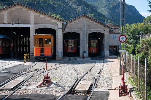 An old train at the station next to the train needle change in Soller, Spain