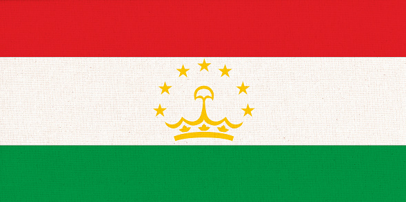 Tajikistan national fabric flag textile background. Symbol of international Asian country. State official tadzhikistan sign. Republic of Tajikistan