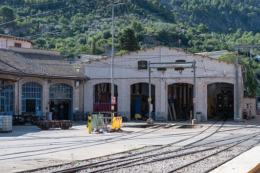 An old workshop and train sheds in the railway station of Soller, Spain