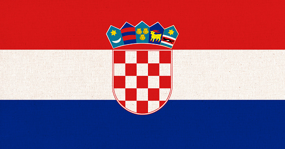 Flag of Croatia. Croatian flag on fabric surface. Fabric texture. National symbol of France on patterned background. Republic of Croatia