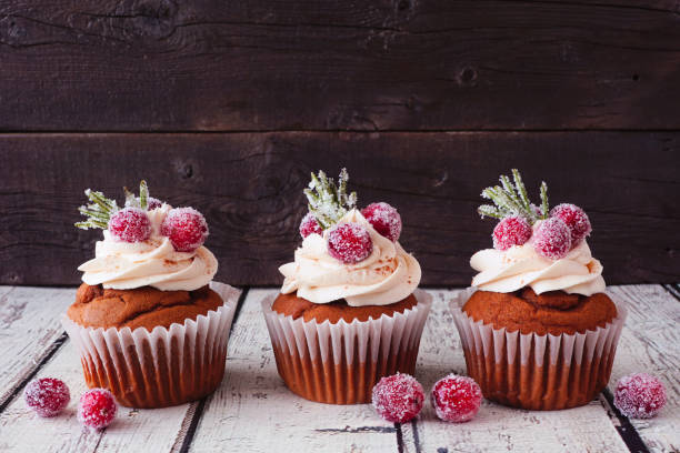 istock Christmas cupcakes with frosty cranberries 1435624838