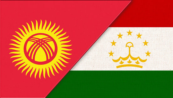 War between Kyrgyzstan and Tajikistan. Military conflict between Kyrgyzstan and Tajikistan. Two Flags Together. Double flag of two Midle Asiatic states. Flags of two warring states. Asian countries