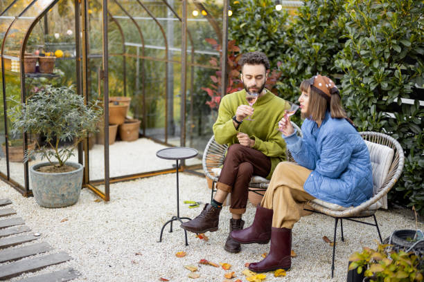 istock Young couple have romantic evening time with wine by the fire 1435628726