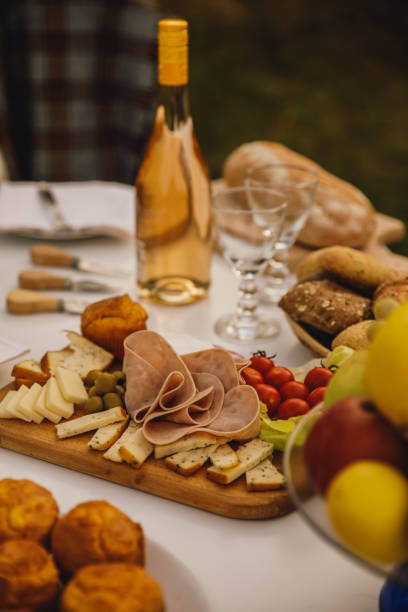 istock Bottle or white wine, tasty rustic buns and charcuterie board 1435629401