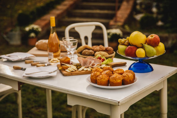 istock Rustic bread, white wine and charcuterie board served on a table to be enjoyed 1435629415