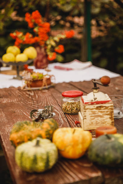 istock Table in the backyard decorated with autumnal knick-knacks and 1435631106