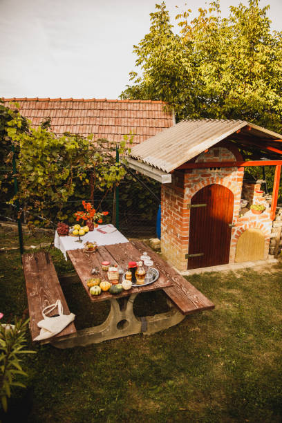 istock Table in the backyard decorated with autumnal knick-knacks and 1435631107