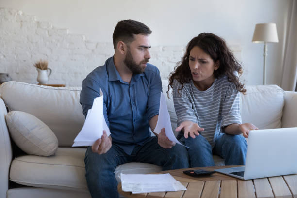 istock Couple making budget analysis feel stressed due to money overspend 1435631349