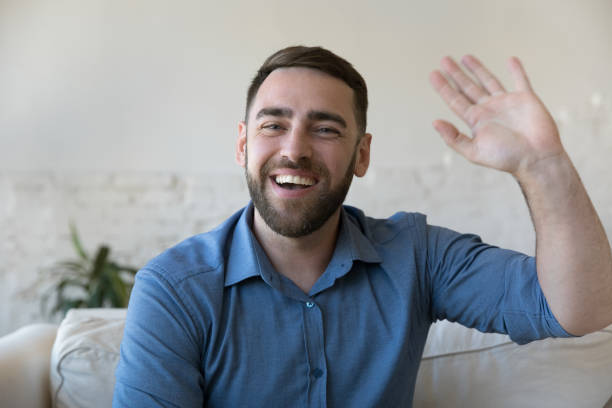 istock Headshot portrait smiling man make video call at home 1435631746